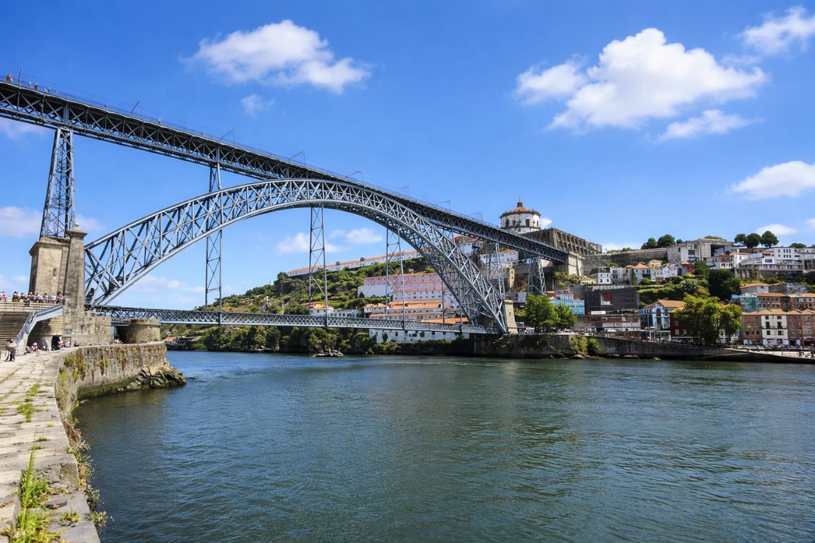 Dom Luís I Bridge over Douro River in Porto with city views captured during a tour with Porto Wine Tours